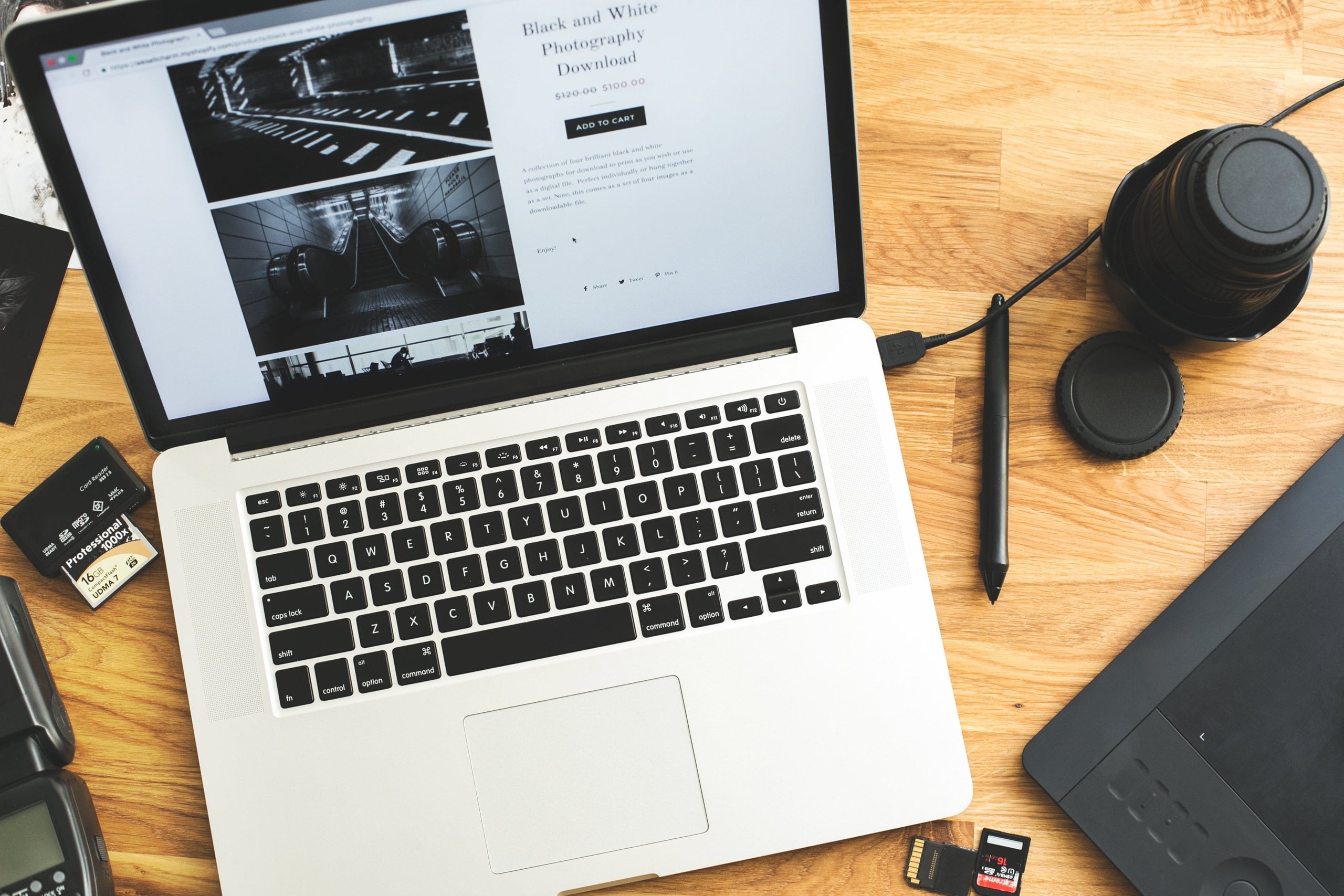 laptop and camera equipment on desk